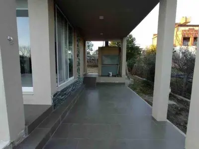 an empty porch of a white house at Casa Cabalango in Cavalango