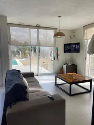 a living room with a couch and a coffee table at Casa Cabalango in Cavalango