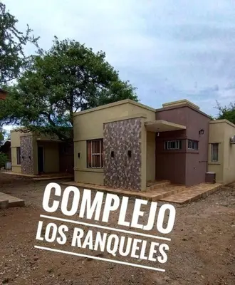 a house with a sign in front of it at Cabañas Los Ranqueles in Merlo