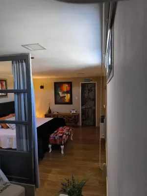 a view of a room with a bed and a table at Complejo Varge Norte in Alta Gracia