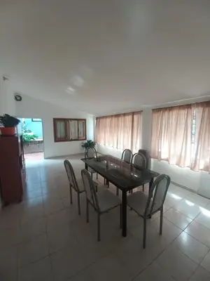 a dining room with a table and chairs at Departamento Peña in Villa Carlos Paz