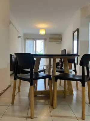 a dining room table and chairs in a room at Raiz - Alquileres Temporarios in Cordoba