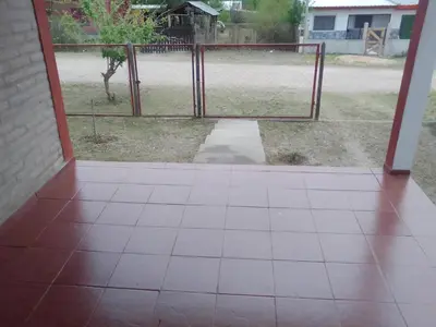 an open door with a gate in a yard at Casa de campo in Bialet Massé