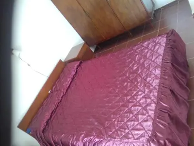 an overhead view of a pink bed in a room at Casa de campo in Bialet Massé