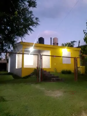 a yellow house with a light on top of it at Casa de campo in Bialet Massé