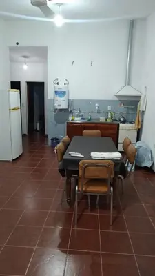 a kitchen with a table and chairs in a room at Casa de campo in Bialet Massé