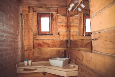 a bathroom with a sink and a window at Cabañas del Peñón in La Cumbrecita