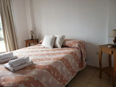 a bedroom with a bed with two pillows on it at Departamento en Barrio Centro calle Corro in Cordoba