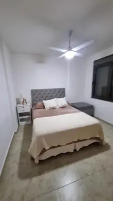 a bedroom with a bed and a ceiling fan at Premium Apartamento in Río Cuarto
