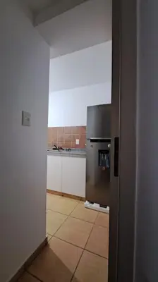 a kitchen with a stainless steel refrigerator in a room at Cordoba sobre Costanera 2 dormitorios con Estacionamiento in Cordoba