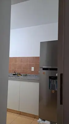 a kitchen with a stainless steel refrigerator and a counter at Cordoba sobre Costanera 2 dormitorios con Estacionamiento in Cordoba