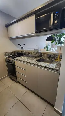 a kitchen with a stove and a sink at Departamento -Brasil- Pleno Nueva Cordoba By Apartcba in Cordoba