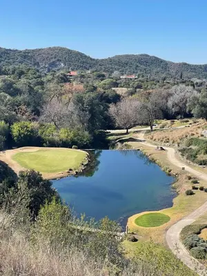 a view of a pond on a golf course at Casa en Potrerillo de Larreta Magicas Vistas in Alta Gracia