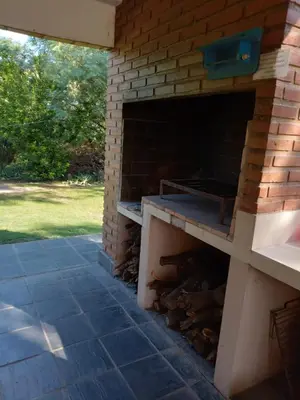 an outdoor brick oven with a grill in it at chalet la granadilla in Cerro de Oro