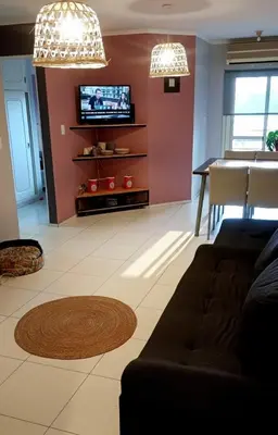 a living room with a couch and a table and a tv at Rincón del Poeta - Ubicación destacada - Nueva Córdoba in Cordoba