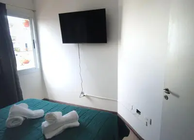 a room with a bed with two towels on it at Apartamento al 5' del Centro in Cordoba