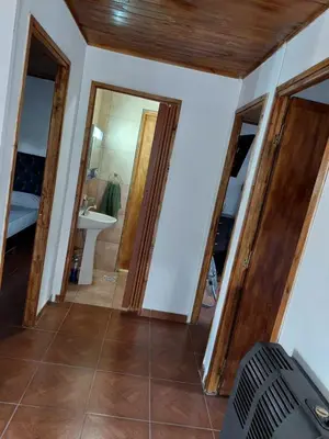 a bathroom with two mirrors and a sink at La soñada in San Antonio de Arredondo