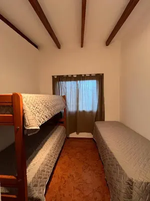a bedroom with two bunk beds and a window at Montecielo in San Antonio de Arredondo