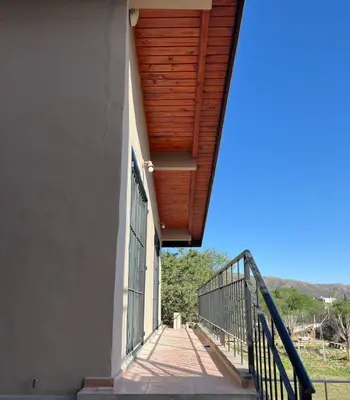 a stairway leading up to a building with a wooden ceiling at Montecielo in San Antonio de Arredondo
