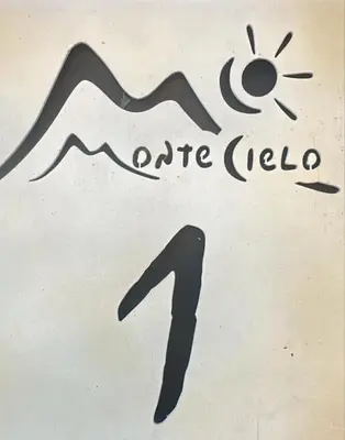 a sign with the sun and the number four at Montecielo in San Antonio de Arredondo