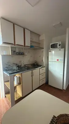 a kitchen with a white refrigerator and a white refrigerator freezer at Montecielo in San Antonio de Arredondo
