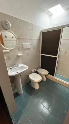 a bathroom with a toilet and a sink at Montecielo in San Antonio de Arredondo