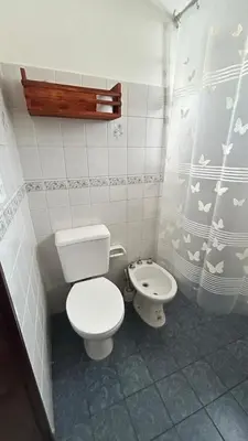 a small bathroom with a toilet and a bidet at 760 C Apartamentos in Alta Gracia