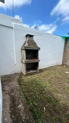 a bird house sitting on the side of a wall at 760 C Apartamentos in Alta Gracia