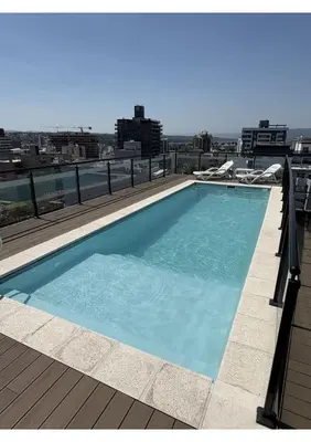 a large swimming pool on top of a building at Departamento Moderno Céntrico in Villa Carlos Paz