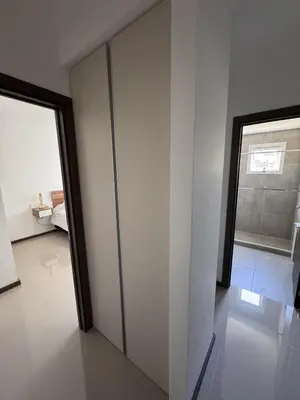 an empty room with a door and a window at Departamento Moderno Céntrico in Villa Carlos Paz