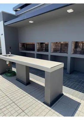 a large white bench sitting in a building at Departamento Moderno Céntrico in Villa Carlos Paz