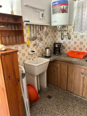 a small kitchen with a sink and a microwave at Chalet Doña Ines in Cuesta Blanca