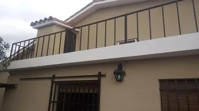 a balcony on the side of a house at Chalet Doña Ines in Cuesta Blanca