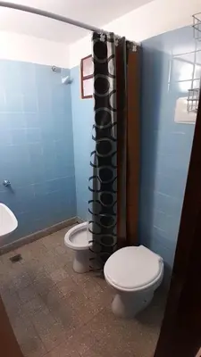 a bathroom with a toilet and a sink in a room at Chalet Doña Ines in Cuesta Blanca
