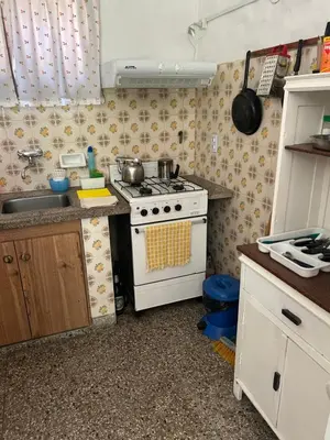 a small kitchen with a stove and a sink at Chalet Doña Ines in Cuesta Blanca