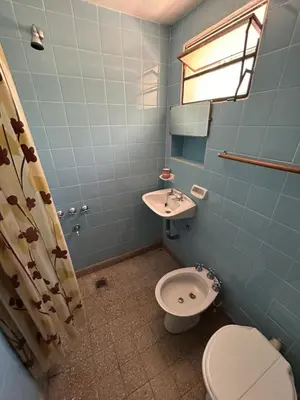 a bathroom with a toilet and a sink at Chalet Doña Ines in Cuesta Blanca