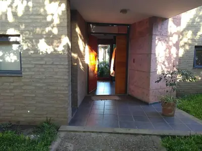 a hallway leading to a house with a door at Casa Los Algarrobos in Cordoba