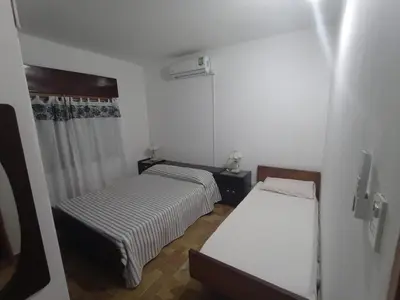 a small room with two beds in it at Casa Tupungato in Villa Carlos Paz