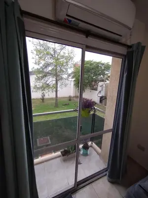 a window with a view of a yard at Departamento Boutique in Cordoba