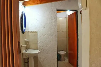 a bathroom with a sink and a toilet at Complejo Salamanca - Cabaña La Catalana in Trapiche