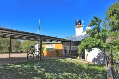 a bike parked in front of a building at Complejo Salamanca - Cabaña La Catalana in Trapiche
