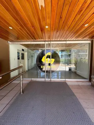 a lobby of a building with a sign on the wall at Departamento en terra forte 1 in Cordoba