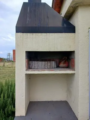 a outdoor shelter with a dog sleeping in it at La Toscana in Villa Yacanto