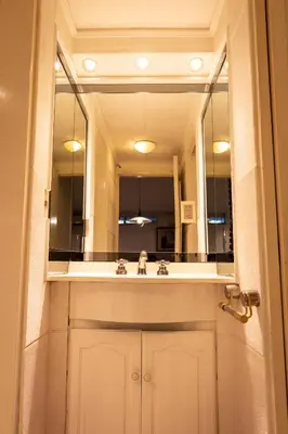 a bathroom with a sink and a large mirror at Casa con pileta exclusiva a 3 cuadras de la costanera Villa Carlos Paz IG alquilervillacarlospaz in Villa Carlos Paz