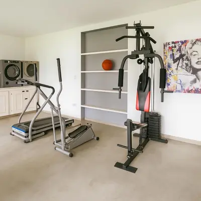 a gym with two exercise bikes in a room at Atenea Residence in Cordoba