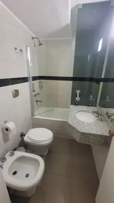 a bathroom with a toilet and a sink and a shower at MONOAMBIENTE VILAUT Temporario in Cordoba