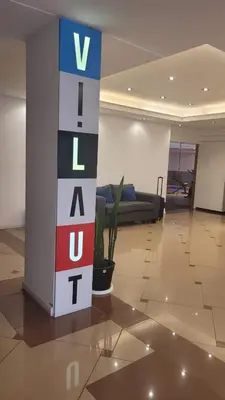 a lobby with a sign that says vale t at MONOAMBIENTE VILAUT Temporario in Cordoba