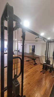 a room with a gym with a light on the ceiling at MONOAMBIENTE VILAUT Temporario in Cordoba
