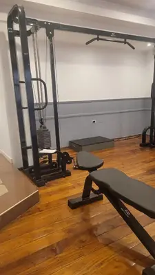 a room with a gym with two tread machines at MONOAMBIENTE VILAUT Temporario in Cordoba