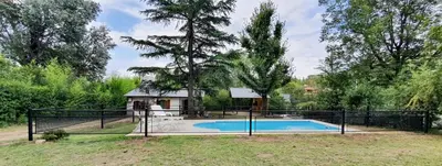 a house with a swimming pool in the yard at Casita en Villa General Belgrano in Villa General Belgrano